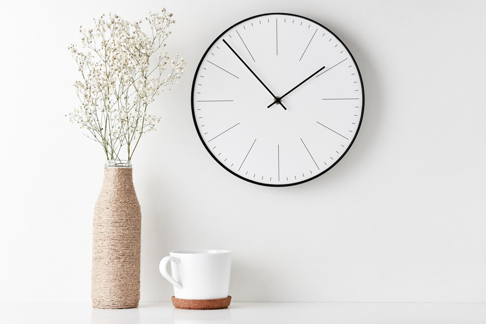 Home office minimal workspace desk with wall clock